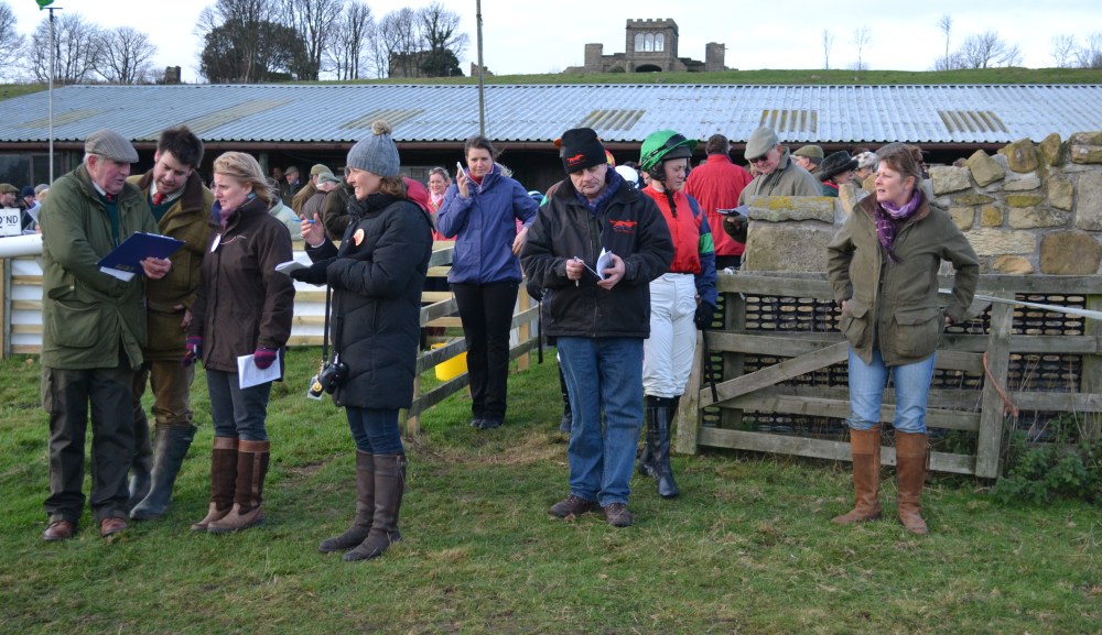 Catherine Walton (emerald green cap) enters the paddock before the ladies open, while Fiona Barr (far right) keeps an eye out for her runner, Optimistic Harry