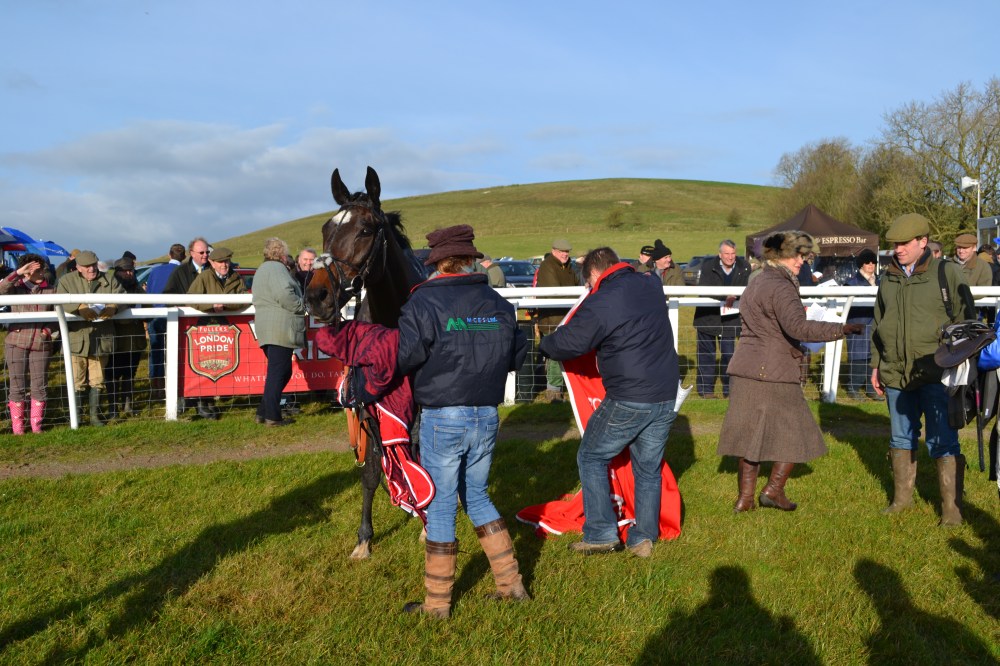Dai Jones moves in with the winners rug for Hall Kelly