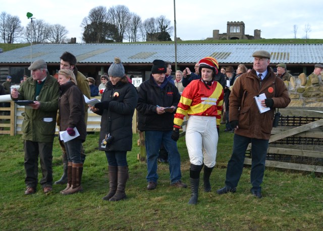 Reigning National Ladies Point-to-Point Champion, Jacqueline Coward, enters the paddock before the ladies open