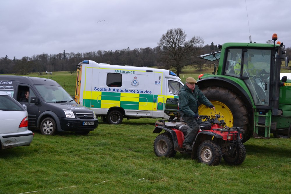 The tractor has just rescued the AGA van from the mud, while clerk of the course James Innes has directed operations from his quad bike