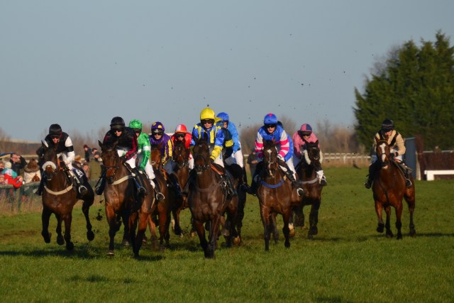 See You Jack (yellow cap) and Now Then Charlie (black) lead the field on the first circuit