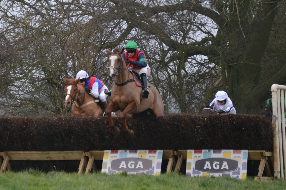 Eventual winner Ockey De Neulliac (green cap) leads on the second circuit of the AGA Ladies Open at Sheriff Hutton