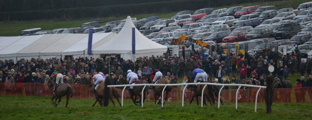 Ockey De Neulliac leads the field out on their final circuit in front of a packed  crowd at Sheriff Hutton