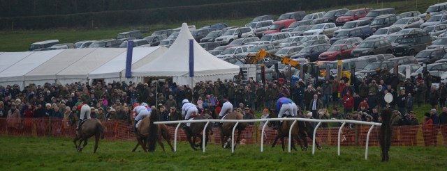 Ockey De Neulliac leads the field out on their final circuit in front of a packed  crowd at Sheriff Hutton