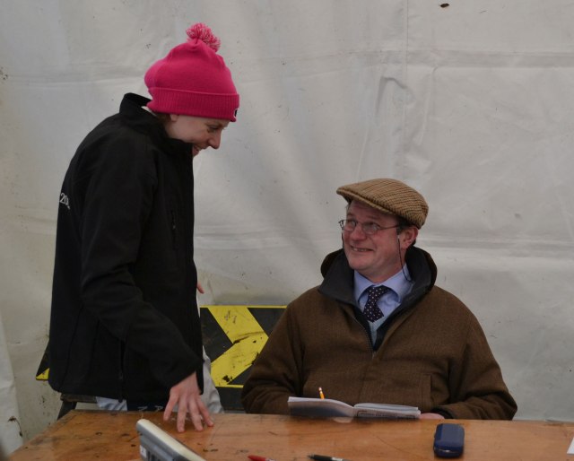 National champion Jacqueline Coward shares a joke with the clerk of the scales