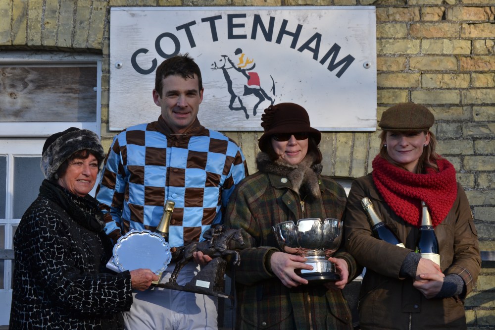 Jockey Stuart Robinson after winning the Mens Open on Brunswick Gold, trainer Rose Grissell (far right) holds onto the bubbly