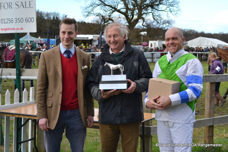 The nice man from Bonhams does the honours after the race