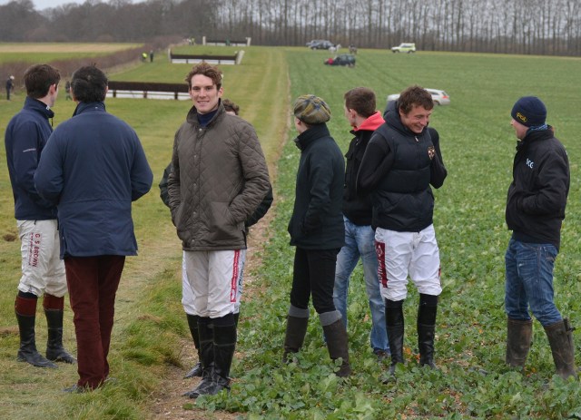 Josh Guerriero and Jimmy Frost are among this group of jockeys watching the race by the final fence