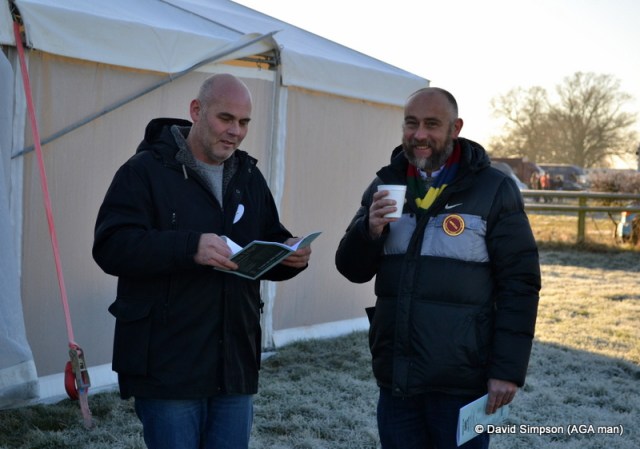 The frost was still thick on the ground but these early arrivals were in good spirits as they studied form.