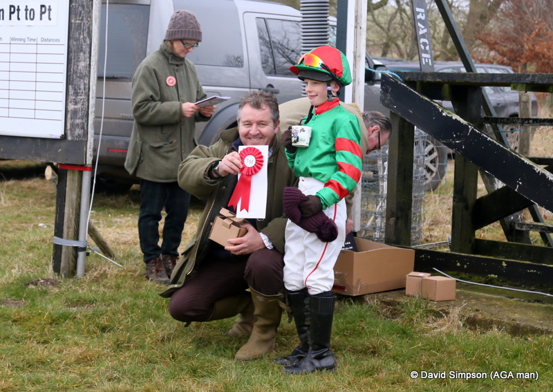 Elliott England receives his rosette and AGA mementoes