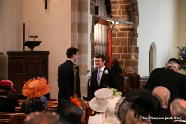 The church is filling up with nice hats and the groom is looking a little nervous!