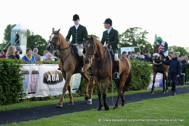 A nice touch as two Hunt horses lead our winner in