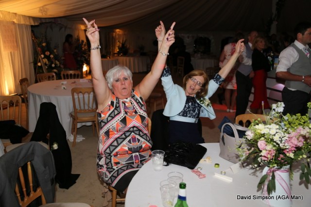 The mothers are still going strong, but they have decided to dance in their seats for the rest of the night!
