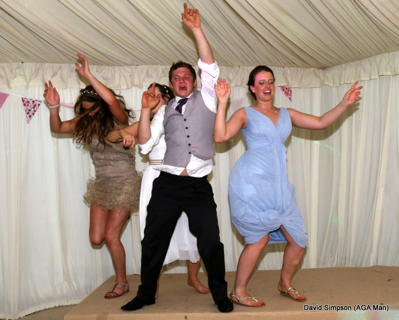 Josh has packed up for the night, but the bride has commandeered the stage!