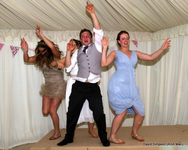 Josh has packed up for the night, but the bride has commandeered the stage!