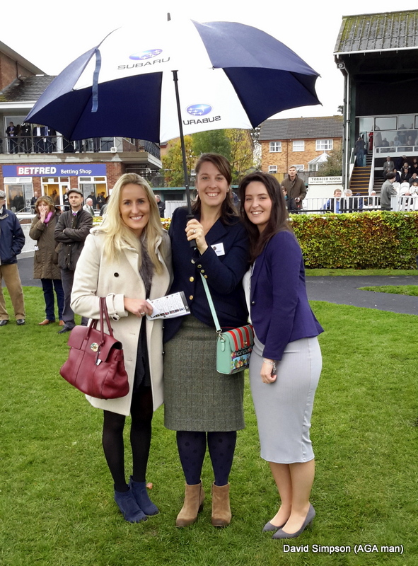 Under the rather smart Subaru umbrella are, L-R: Lucy Wheeler, Steph Holmes and Cara O'Reilly